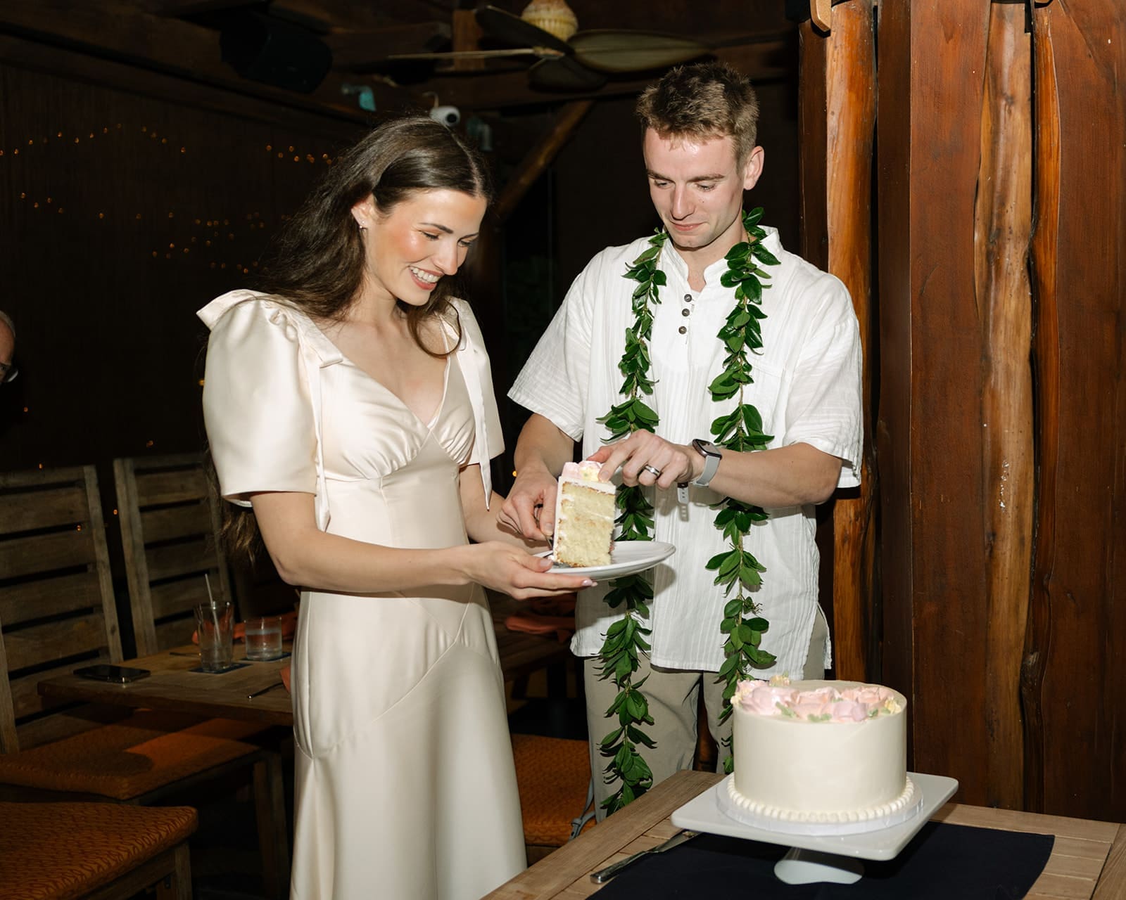 Wedding cake cutting at Beach House in Turtle Bay