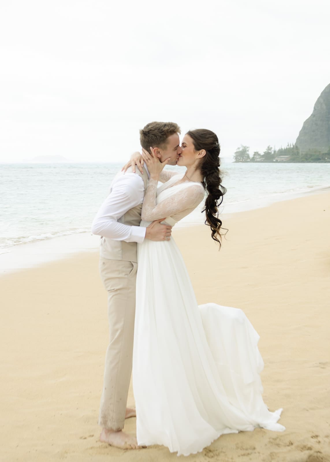 Couple eloping on Ka'a'awa Beach